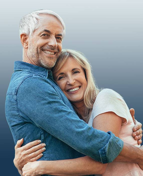 Mature couple holding each other and smiling | Opioid-Substance Abuse Treatment